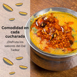Dal Tadka: A bowl of Dal Tadka, topped with aromatic spices and tempering, showcasing the vibrant colors and rich flavors of traditional Indian cuisine.