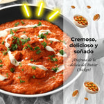 Butter Chicken: "Creamy and aromatic Butter Chicken garnished with fresh coriander, a beloved North Indian dish known for its rich and savory tomato gravy."