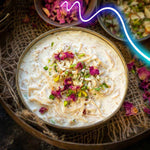 Delicious Seviyan Kheer garnished with dried rose petals, pistachios, and almonds, showcasing a creamy, aromatic Indian dessert perfect for special occasions.