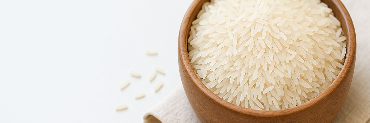 A serving of cooked basmati rice with packs of India Gate Sella Basmati, India Gate Extra Long Basmati, and Daawat Extra Long Basmati rice.