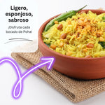 Poha: A bowl of light and fluffy Poha garnished with peanuts and green chilies, a popular and nutritious Indian breakfast dish made with flattened rice.