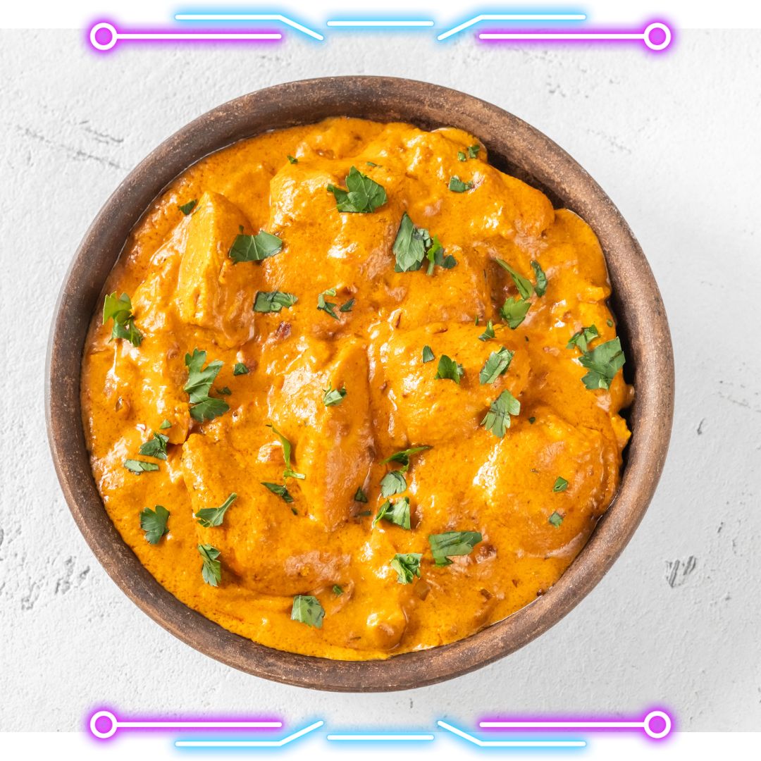 Rich and creamy Butter Chicken garnished with fresh cilantro, showcasing the vibrant orange sauce and tender chicken pieces – a classic Indian delicacy