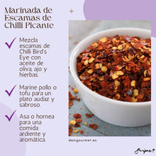 Cargar imagen en el visor de la galería, Meta Description: Add a bold flavor to your chicken or tofu with our Marinada de Escamas de Chilli Picante. This spicy marinade combines Bird&#39;s Eye Chilli flakes with olive oil, garlic, and herbs for an aromatic, flavorful dish. Try it today with Desi Gourmet!