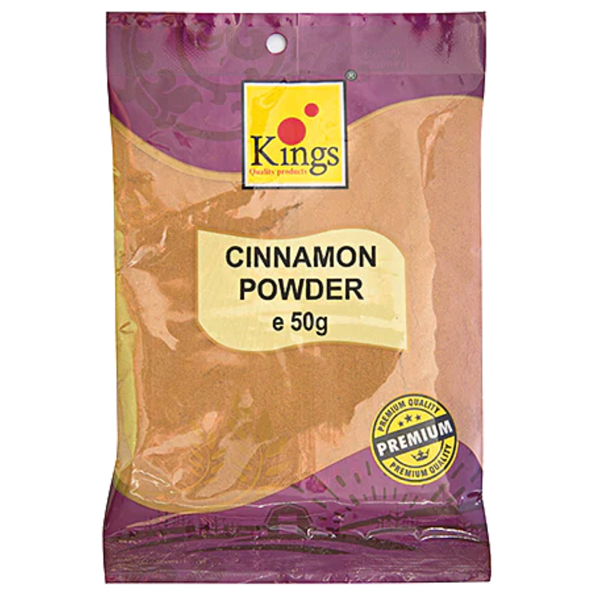 English: A package of Kings Cinnamon Powder, weighing 50g, labeled with "Premium Quality" seal on the front, showing ground cinnamon powder inside.

Spanish: Un paquete de Canela en Polvo Kings de 50g, con un sello en el frente que dice "Calidad Premium", mostrando canela molida en su interior.