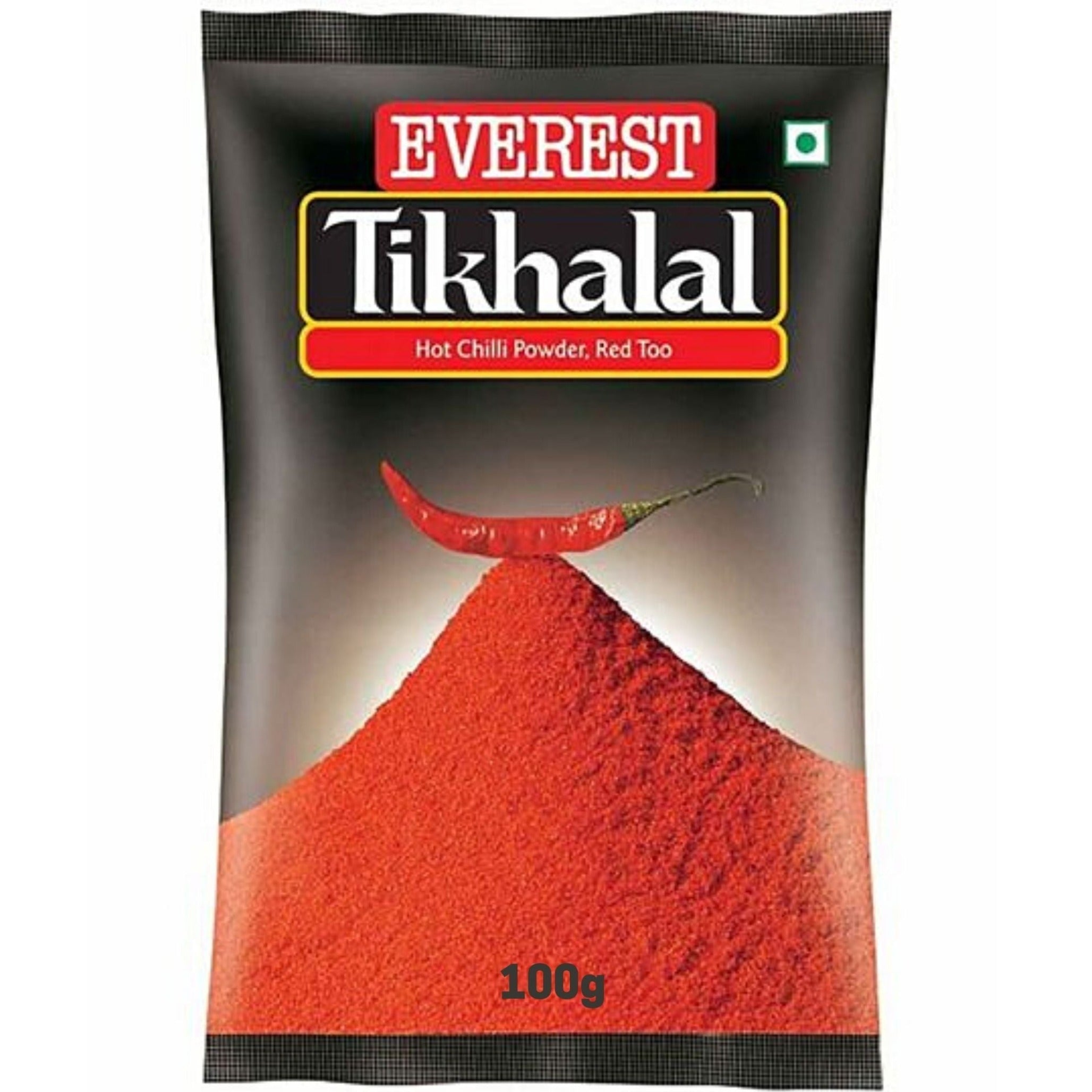 English: A packet of Everest Tikhalal Hot Chilli Powder, featuring a bold design with a vibrant red chili pepper and a pile of bright red chili powder. The packaging displays the product name "Tikhalal" in bold white letters and highlights its spicy nature with the label "Hot Chilli Powder, Red Too."
Spanish: Un paquete de Everest Tikhalal Hot Chilli Powder, con un diseño audaz que muestra un vibrante chile rojo y una pila de polvo de chile rojo brillante. El empaque muestra el nombre del producto "Tikhalal